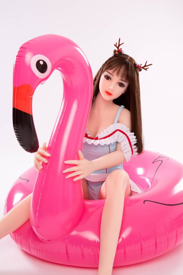 Vibrant pink inflatable flamingo pool float with a realistic beak design, used for summer leisure and pool parties, showcasing playful and stylish float accessories.